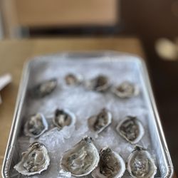 Whole Foods Market - $1/ea oyster (12 min.) on Fridays (shucking service limited to 1 dozen per person/party)