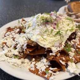 Chicken chilaquiles with an egg on top. Chicken chilaquiles with an egg on top.