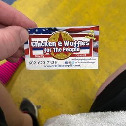 a person holding a sticker a person holding a sticker