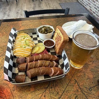Solvang Brewing Company - Lompoc - Beer brat plate with beer. - Breweries Near Me - Lompoc, California
