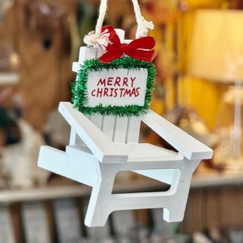 The Sand House - White Adirondack chair ornament with a Merry Christmas wreath sign and a red bow - Home Decor Near Me - Point Pleasant Beach, New Jersey The Sand House - White Adirondack chair ornament with a Merry Christmas wreath sign and a red bow - Home Decor Near Me - Point Pleasant Beach, New Jersey