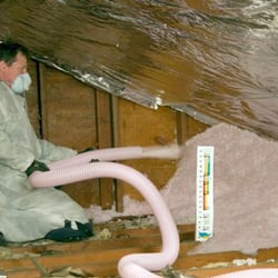 Keeney Home Services - Blown in insulation being applied to an attic.
