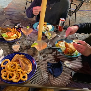 Shay's Grill Pub - two men sitting at a table with plates of food - American Near Me - Portland, Maine Shay's Grill Pub - two men sitting at a table with plates of food - American Near Me - Portland, Maine