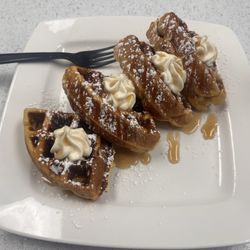 Waffle with syrup and crème.