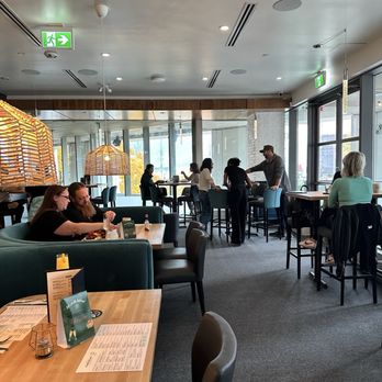 Hard Bean Brunch - mix of wood tones and rattan light fixtures adds a casual yet modern charm to the room - Breakfast & Brunch Near Me - Vancouver, British Columbia