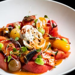 Edan Bistro - Tomato Salad: with cantabrian anchovies, burrata cheese, basil and smoked tomato vinaigrette