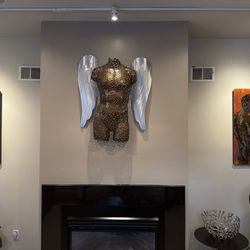 Male and female art created with recycled material materials