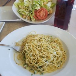 Olive oil spaghetti cesar sals and a pitcher of sangria