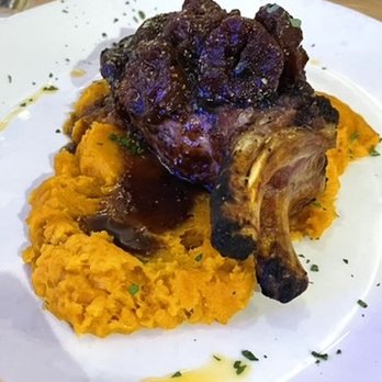 Plori Restaurant - double pork chop over sweet potatoes with a fig and wine topping - Greek Near Me - Carle Place, New York