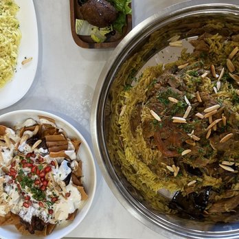 Yalla Nakol - various dishes of food on a table - Middle Eastern Near Me - Windsor, Ontario