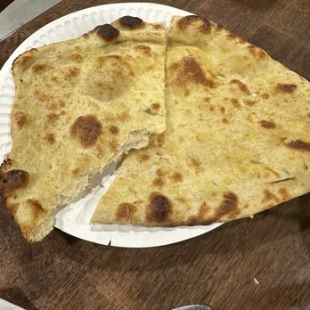 Sanjha Indian Cuisine - Garlic Naan - the best! - Indian Near Me - Santo, Texas Sanjha Indian Cuisine - Garlic Naan - the best! - Indian Near Me - Santo, Texas