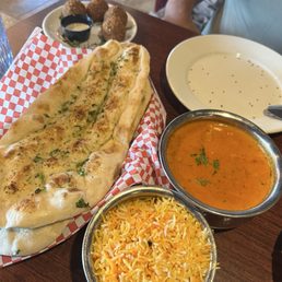 Butter chicken & garlic naan comes with rice Butter chicken & garlic naan comes with rice