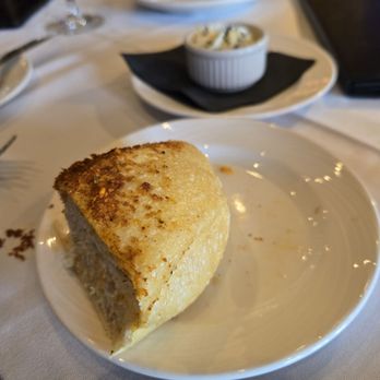 Eddie Merlot's - Bread with black salted butter - Steakhouses Near Me - Englewood, Colorado Eddie Merlot's - Bread with black salted butter - Steakhouses Near Me - Englewood, Colorado