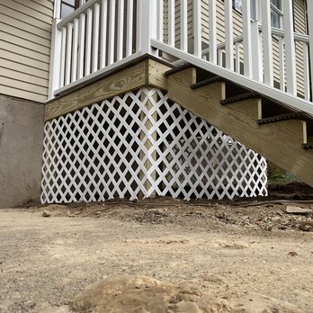 CNY Home Renovations - a porch with a lattice fence - General Contractors Near Me - Cicero, New York CNY Home Renovations - a porch with a lattice fence - General Contractors Near Me - Cicero, New York