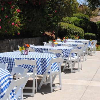 Party Solutions - Party #1. Blue checkered table cloths 72" round tables. White padded chairs. - Party Supplies Near Me - Corona, California Party Solutions - Party #1. Blue checkered table cloths 72" round tables. White padded chairs. - Party Supplies Near Me - Corona, California