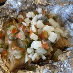 Taco Bueno - Tiny brisket tamales covered in condiment bar pico