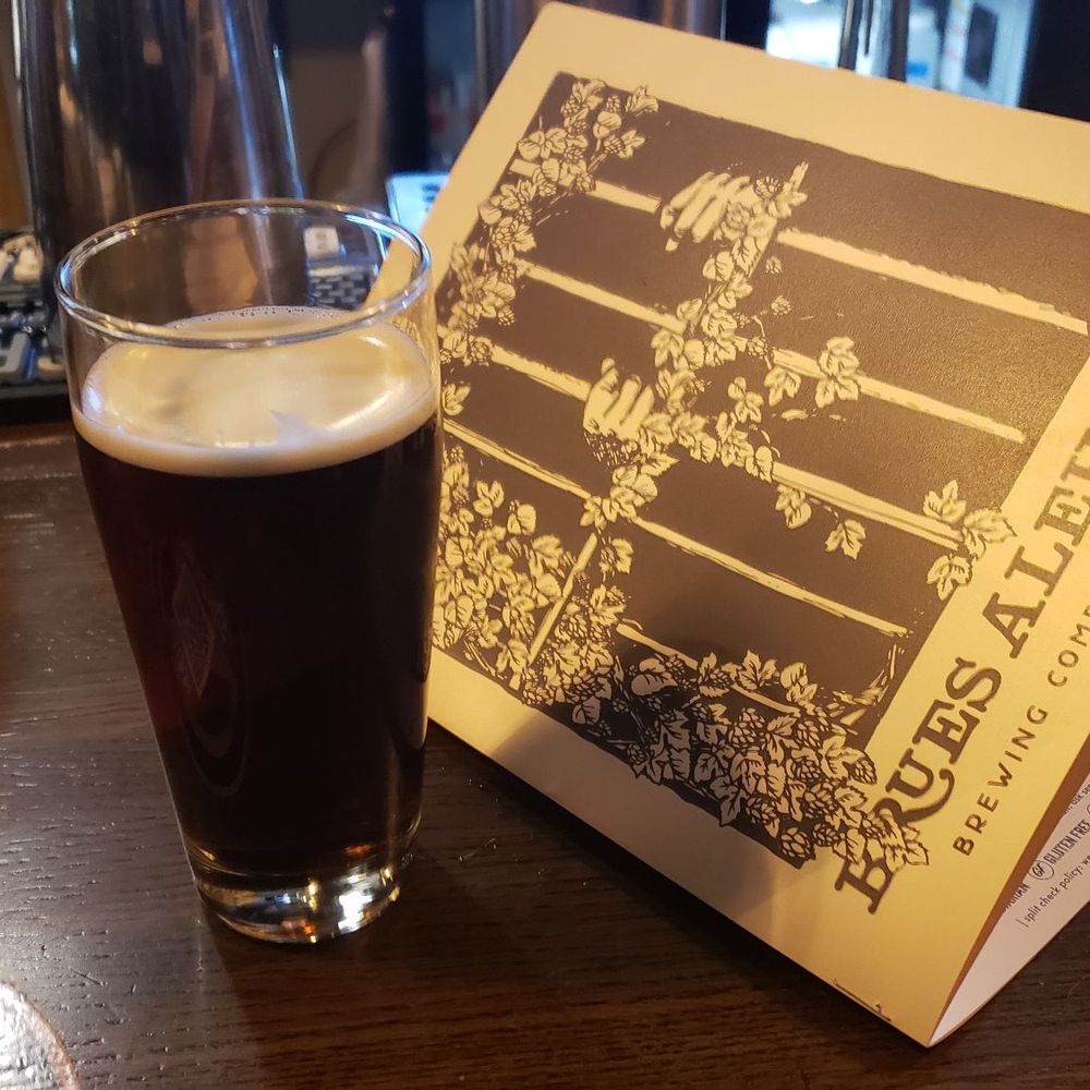 Brues Alehouse - Fantastic pint of stout and menu cover. - Breweries Near Me - Pueblo, Colorado Brues Alehouse - Fantastic pint of stout and menu cover. - Breweries Near Me - Pueblo, Colorado