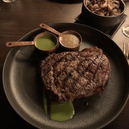 18oz Delmonico Ribeye with chimichurri sauce and peppercorn sauce. Paired with the sautéed mushrooms.