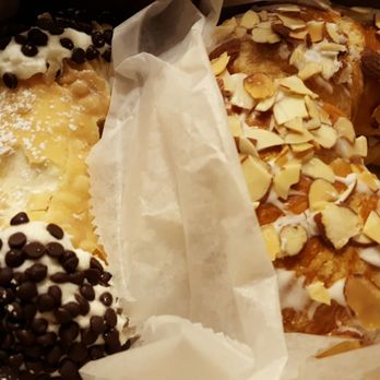 Mike's Pastry - Chocolate chip cannoli and an almond croissant. - Bakeries Near Me - Boston, Massachusetts Mike's Pastry - Chocolate chip cannoli and an almond croissant. - Bakeries Near Me - Boston, Massachusetts