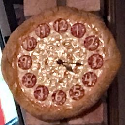 Nancy has the perfect clock right by the take out window. It's always pizza time! Nancy has the perfect clock right by the take out window. It's always pizza time!