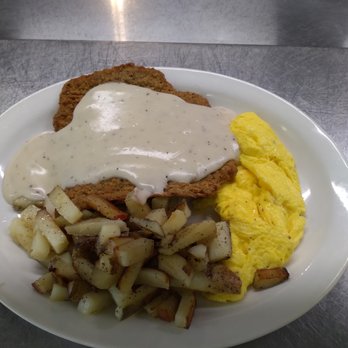 Country Way Cafe - a plate of food with eggs, potatoes, and gravy - American Near Me - Mulberry, Florida