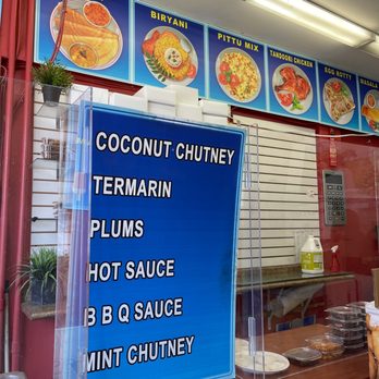 Suruthi's Take Out & Catering - Menu stretches along the top of the wall. - Indian Near Me - Toronto, Ontario Suruthi's Take Out & Catering - Menu stretches along the top of the wall. - Indian Near Me - Toronto, Ontario