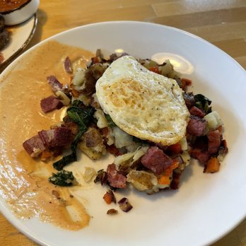 The Sheffield - Homemade corned  beef hash with fried  egg and thousand island dressing - Bars Near Me - Rochester, New York