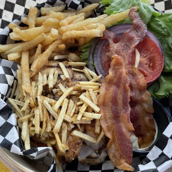 The Pointe - Mahi Mahi sandwich comes with bacon and crispy potato shoestring - Burgers Near Me - Captiva, Florida The Pointe - Mahi Mahi sandwich comes with bacon and crispy potato shoestring - Burgers Near Me - Captiva, Florida