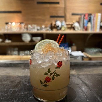 Pickerel - a close up of a cocktail with a slice of lime - Ramen Near Me - Providence, Rhode Island Pickerel - a close up of a cocktail with a slice of lime - Ramen Near Me - Providence, Rhode Island