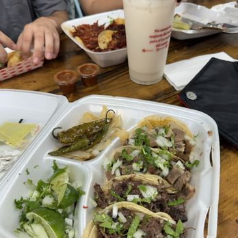 Taqueria El Arquito - 2 barbacoa Tacos and 2 lengua Tacos (bottom) Horchata drink in cup in middle. - Mexican Near Me - Royse City, Texas Taqueria El Arquito - 2 barbacoa Tacos and 2 lengua Tacos (bottom) Horchata drink in cup in middle. - Mexican Near Me - Royse City, Texas