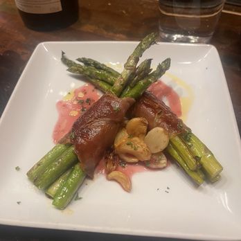 Debajo Tapas ABQ - Asparagus wrapped in Jamo Serrano and roasted garlic. - Spanish Near Me - Albuquerque, New Mexico