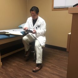 Coastal Pulmonary Associates - Dr. Hsing looking up types of CPAP machines. Those coat pockets hold everything!