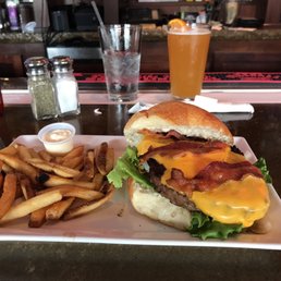 Bacon cheeseburger and fries. Bacon cheeseburger and fries.