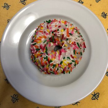 Sy Donuts - a sprinkled donut on a white plate - Donuts Near Me - Brea, California Sy Donuts - a sprinkled donut on a white plate - Donuts Near Me - Brea, California