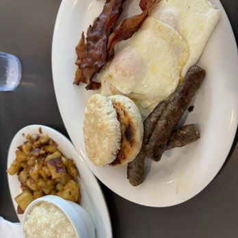 Eggs Up Grill - Breakfast Combo with grits, eggs, home fries, bacon, sausage, and biscuit. - Breakfast & Brunch Near Me - Leland, North Carolina
