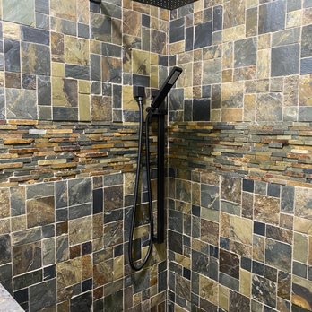 Creve Coeur Plumbing - a shower with a black shower head - Plumbing Near Me - Saint Charles, Missouri Creve Coeur Plumbing - a shower with a black shower head - Plumbing Near Me - Saint Charles, Missouri