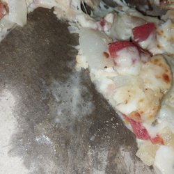 Domino's Pizza - I'm sorry but does that look like spit to u?. Only under one slice.