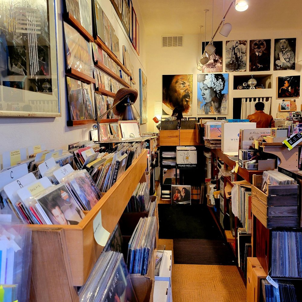 Open Mind Music - Looking down aisle from front to back of store - Music & DVDs Near Me - Oakland, California