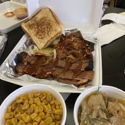 Nola Smokehouse - 2 meat combo - pulled pork, smoked brisket, corn, and  smothered cabbage