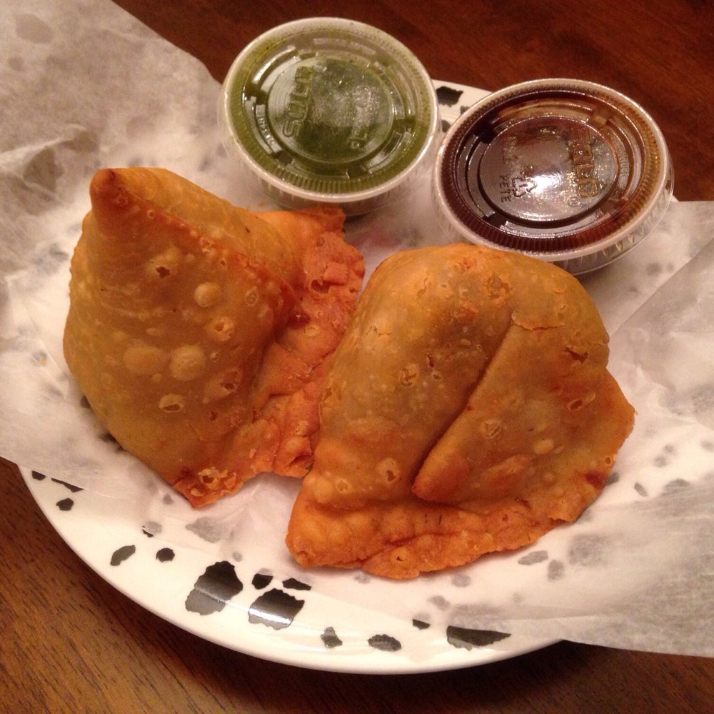 Delhi Garden - Veg. samosas (spiced potatoes and peas) with cilantro chutney and a sweet tamarind sauce - Indian Near Me - Edison, New Jersey Delhi Garden - Veg. samosas (spiced potatoes and peas) with cilantro chutney and a sweet tamarind sauce - Indian Near Me - Edison, New Jersey