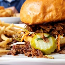 20 Mile Tap House - New menu item - brisket sandwich with coleslaw pickles jalapeno coins and chipotle barbecue sauce serve with fries or tops