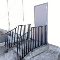 J Tex Fabrication - Turnkey project by JTEX, new metal door installed, concrete staircase, and safety handrails fabricated for local shopping center.