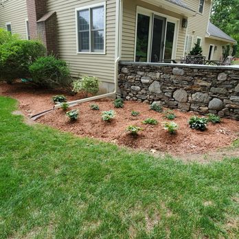 B&B Outdoor Solutions - a stone retaining wall in the front yard - Fences & Gates Near Me - Draper, Utah