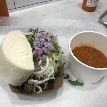 Ekiben - The Borrego (Lamb) bao, with salsa roja! Thai tea bottle in the back too. - Asian Fusion Near Me - Baltimore, Maryland Ekiben - The Borrego (Lamb) bao, with salsa roja! Thai tea bottle in the back too. - Asian Fusion Near Me - Baltimore, Maryland