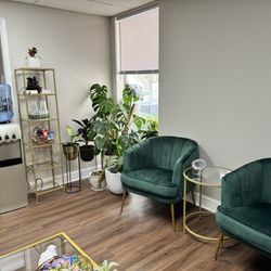 Lashed By Reta - Waiting area. This green is so gorgeous and rich!