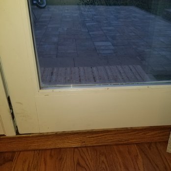 Queens Screen - The bottom left corner of the molding is chipped with staple holes along the glass. - Windows Installation Near Me - Center Moriches, New York