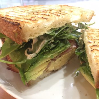 Tractor Foods - Breakfast sandwich (eggs, cheese, arugula, garlic aioli on sourdough) with added bacon & avocado - Sandwiches Near Me - Vancouver, British Columbia Tractor Foods - Breakfast sandwich (eggs, cheese, arugula, garlic aioli on sourdough) with added bacon & avocado - Sandwiches Near Me - Vancouver, British Columbia