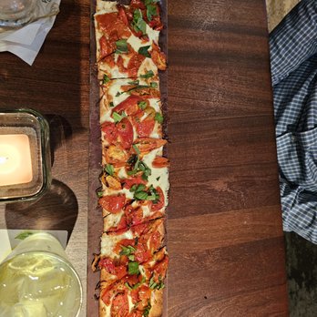 Seasons 52 - Roasted Tomato Flatbread - New American Near Me - Costa Mesa, California Seasons 52 - Roasted Tomato Flatbread - New American Near Me - Costa Mesa, California