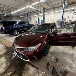 Auto Center Bargain Lot - Salesman Matt showing my wife her soon to be new car in their heated showroom.