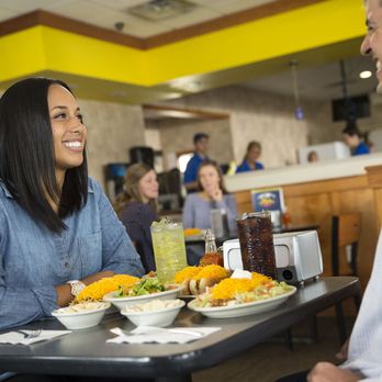 Skyline Chili - a man and a woman sitting at a table with plates of food - Hot Dogs Near Me - Middletown, Ohio Skyline Chili - a man and a woman sitting at a table with plates of food - Hot Dogs Near Me - Middletown, Ohio